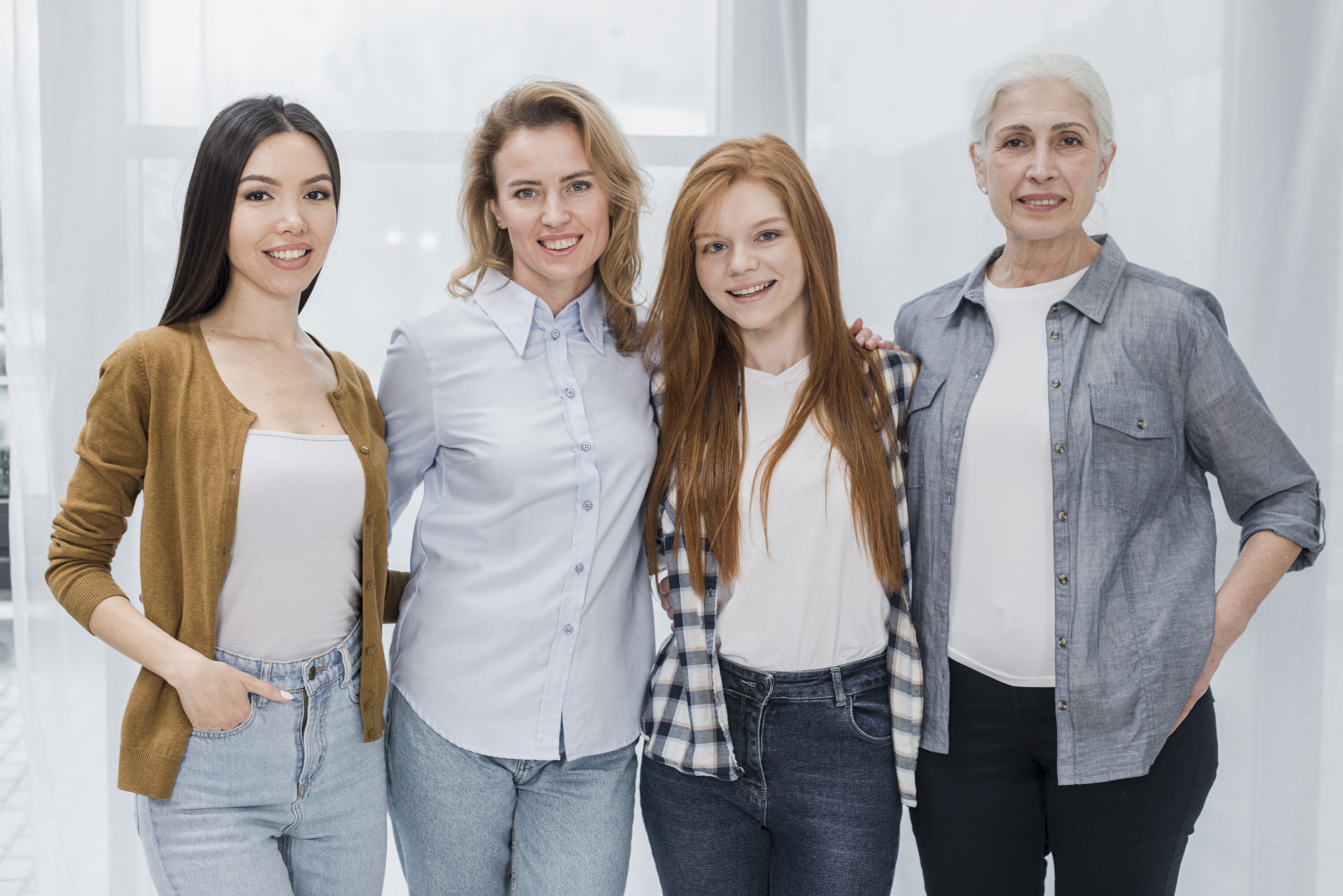 A small group of women standing together indoors