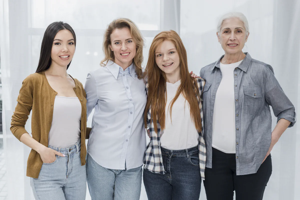 A small group of women standing together indoors